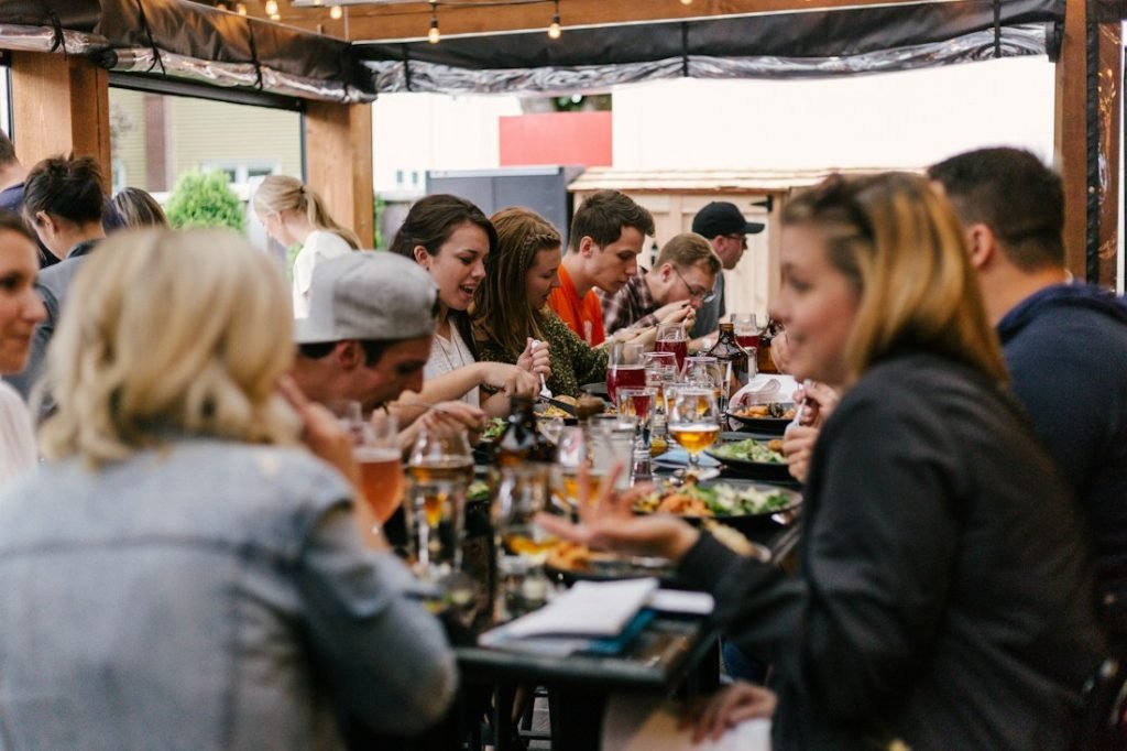 Long table dinner with friends talking