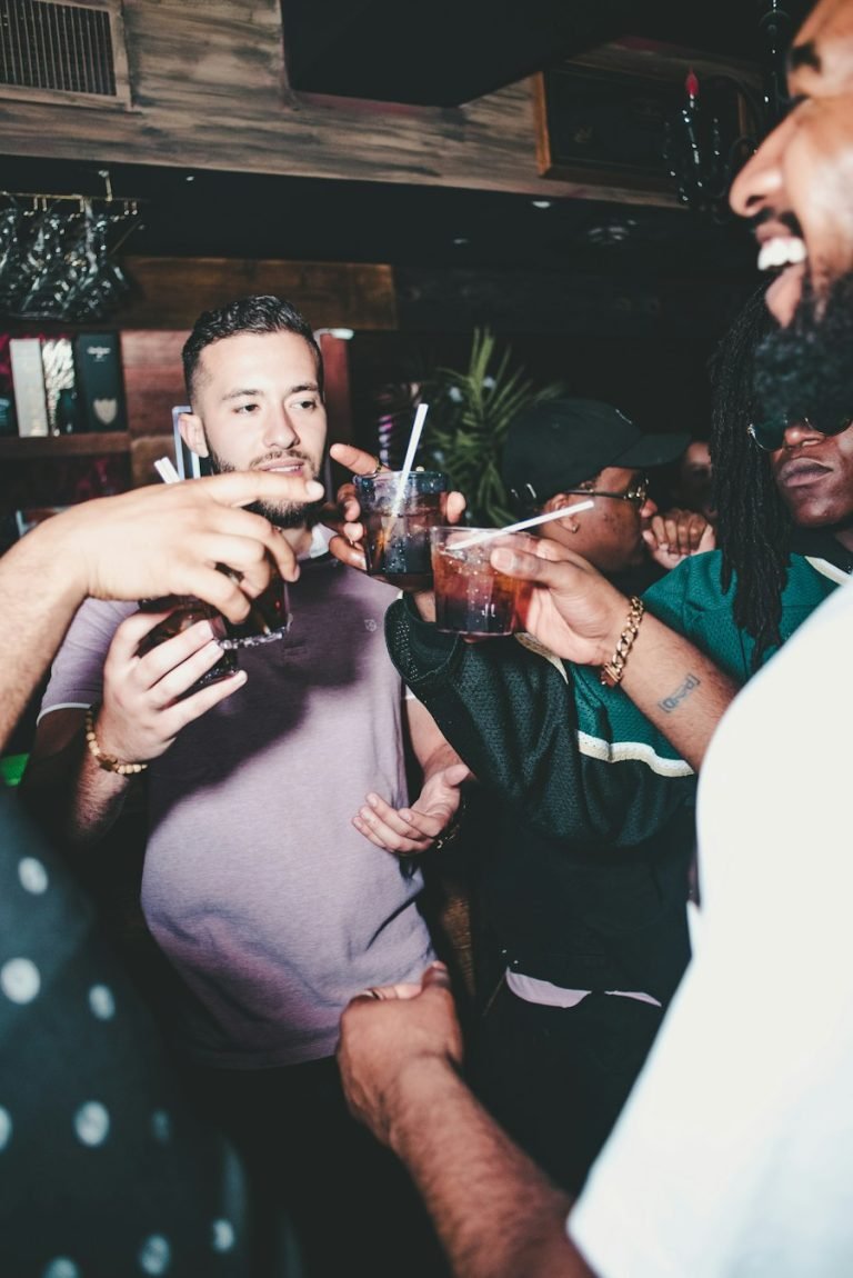 Friends raising their glasses together at a party