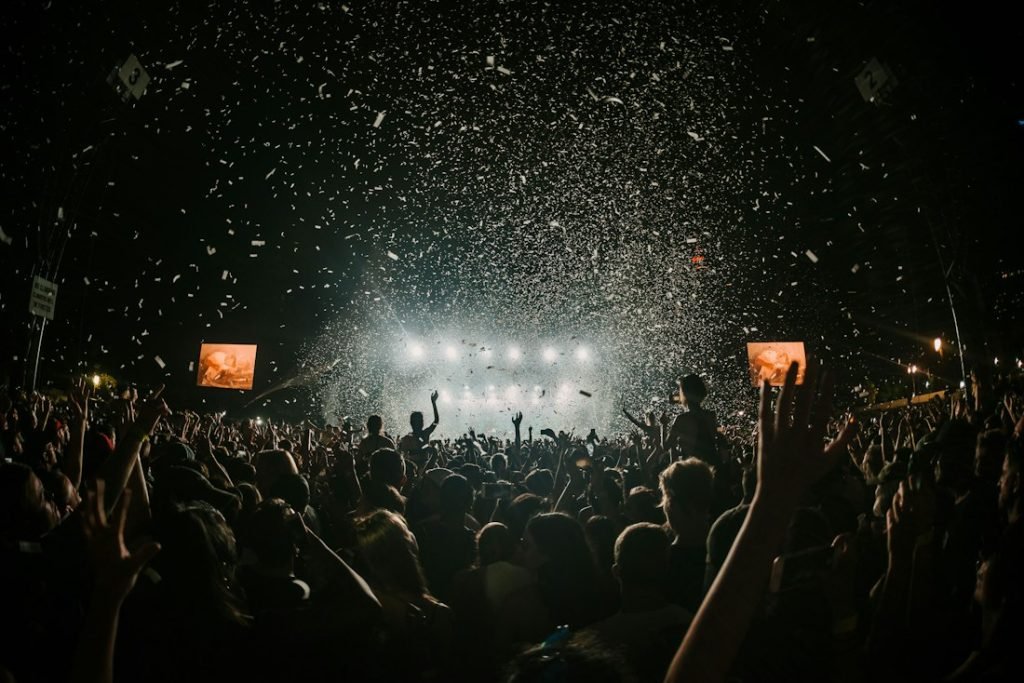 Confetti falling over a big crowd at a live show